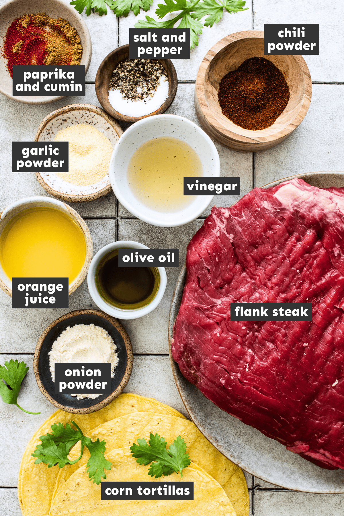 Flank steak ingredients measured out into individual bowls.