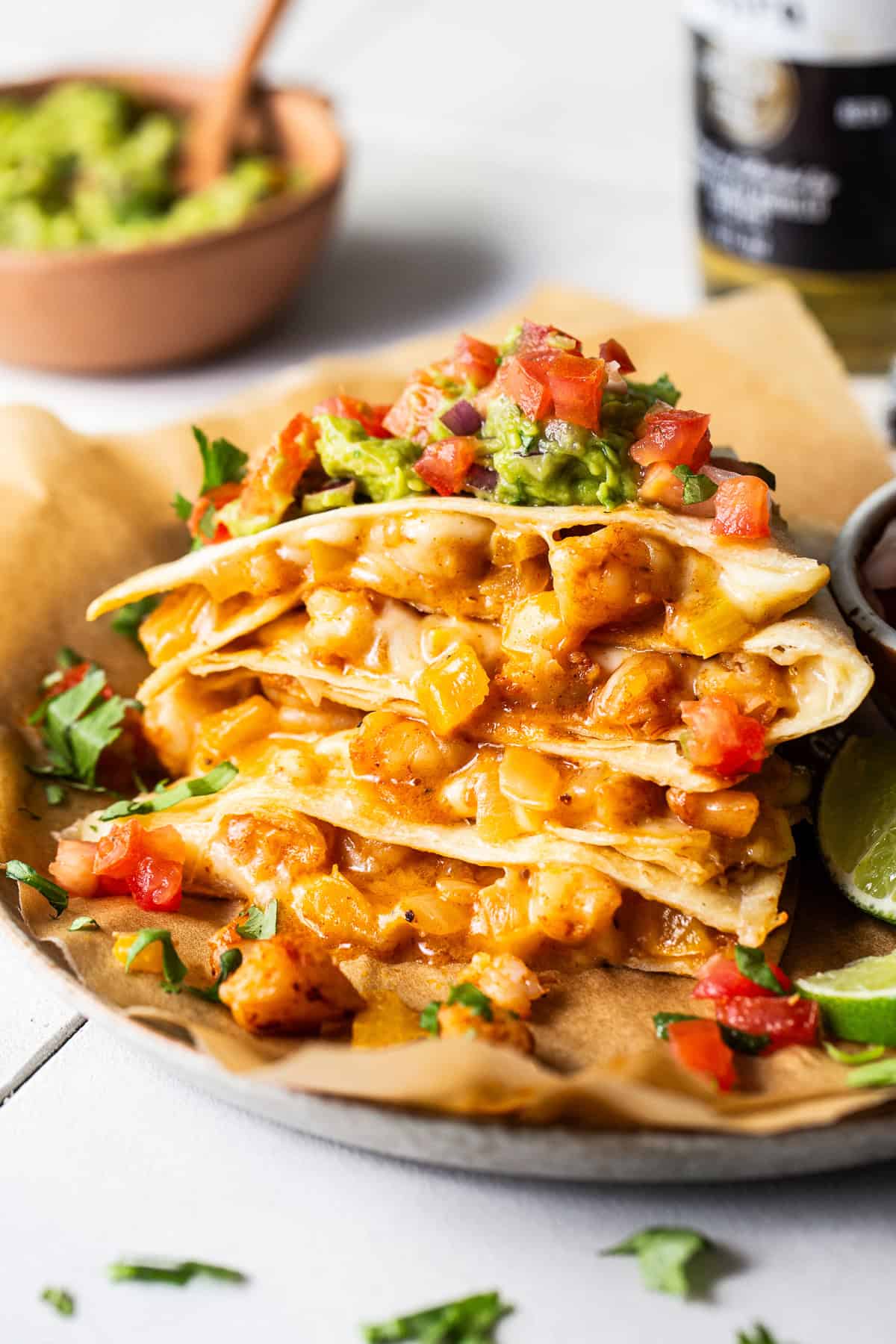 Shrimp quesadillas stacked on top of one another.