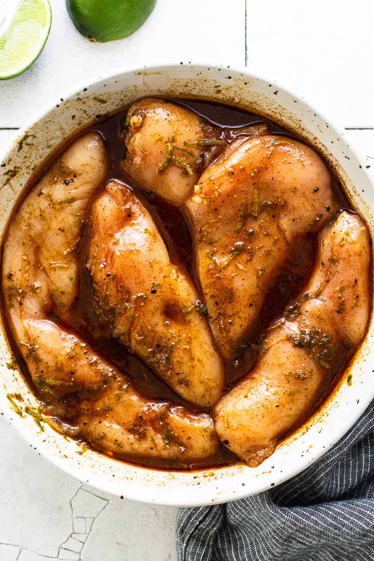 Marinated chicken ready to rest in a fridge