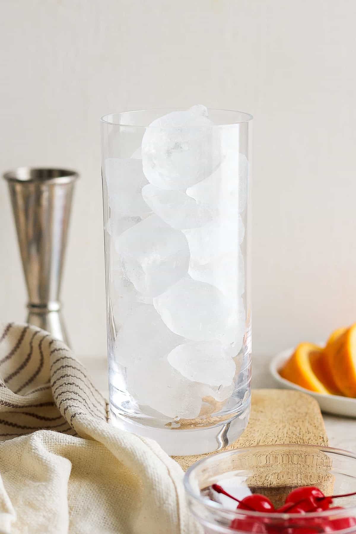 A highball glass filled with ice.
