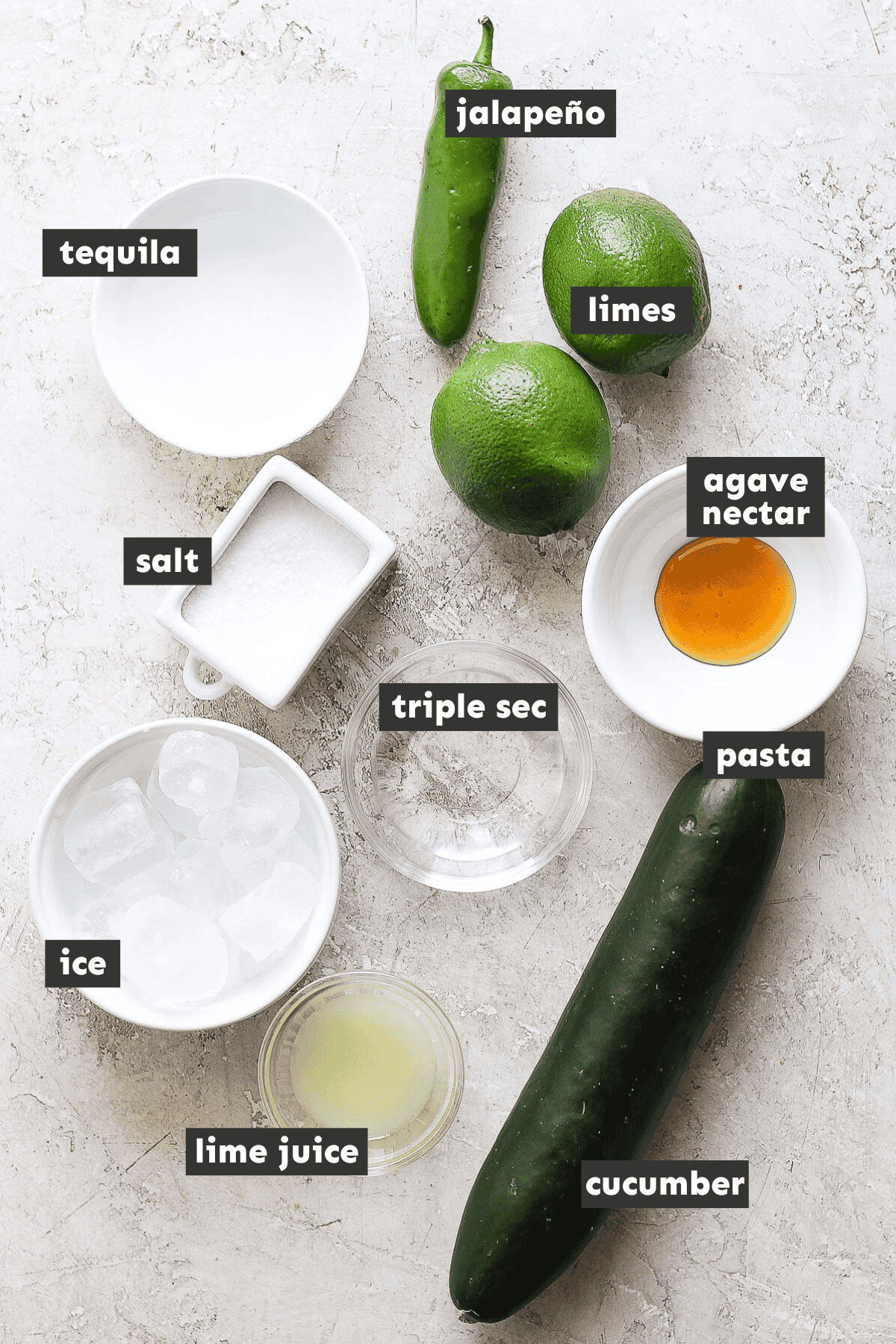 Ingredients in cucumber margaritas on table