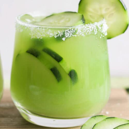 Cucumber margarita in a glass rimmed with salt