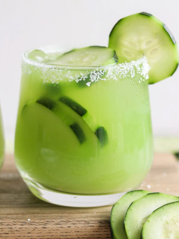 Cucumber margarita in a glass rimmed with salt