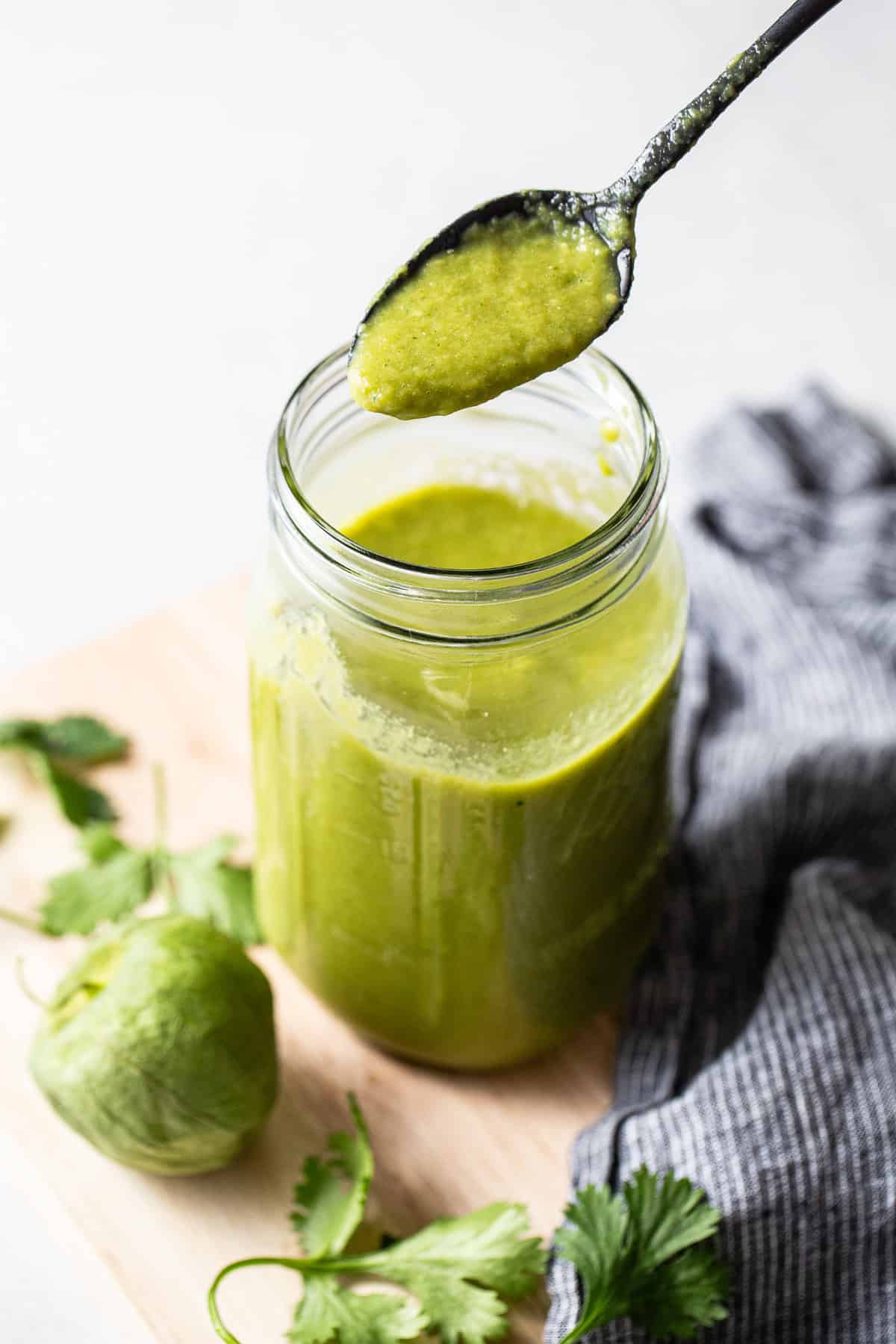 Green enchilada sauce stored in a jar ready to use