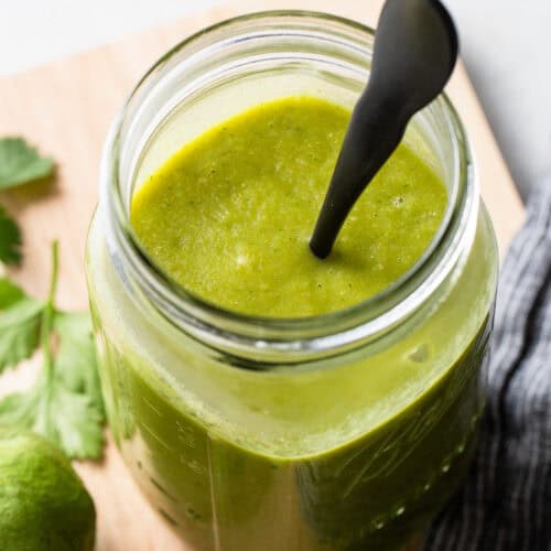 Green enchilada sauce in a jar.