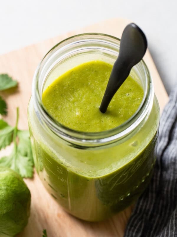 Green enchilada sauce in a jar.