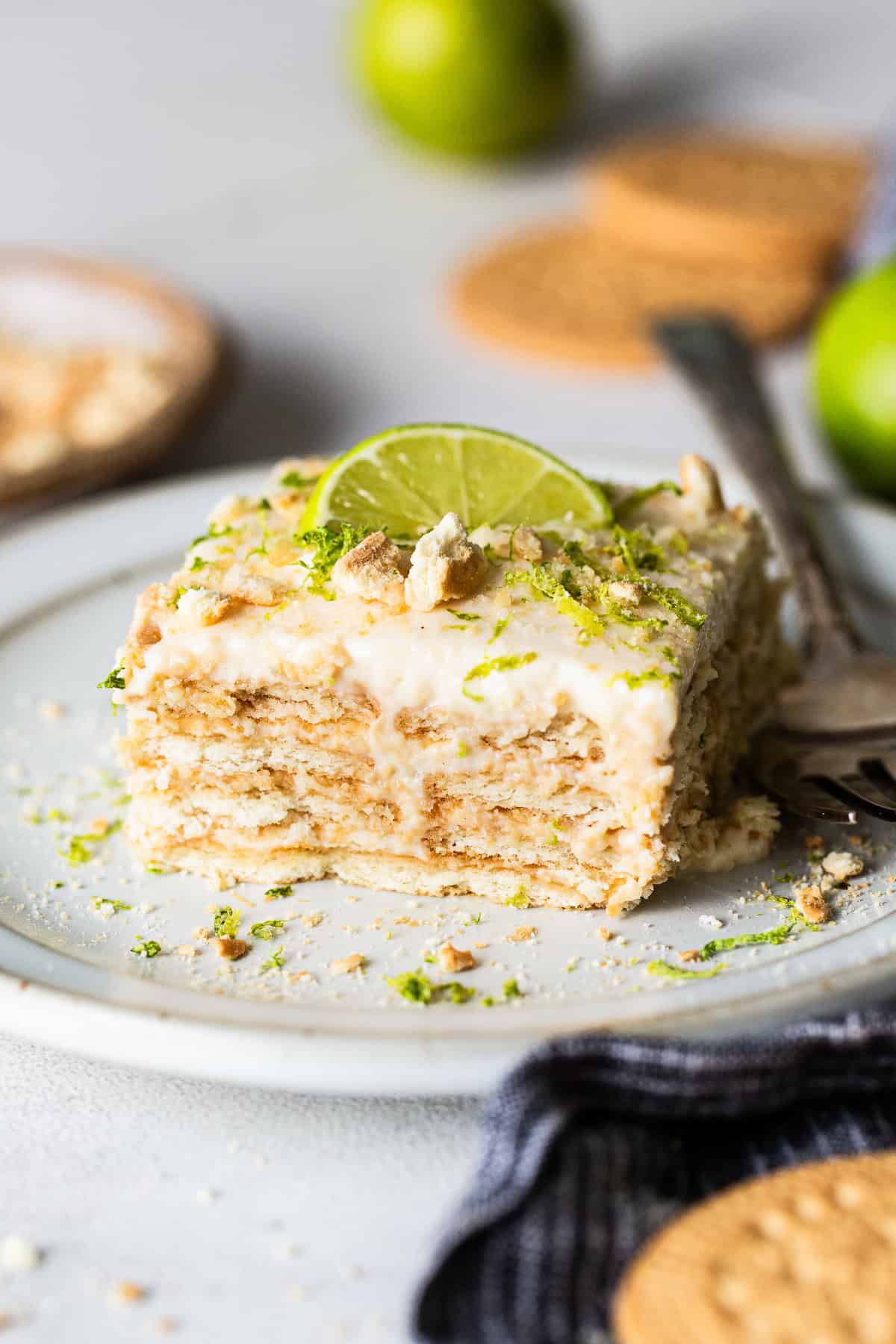 Carlota de limon cut into a square and served on a plate