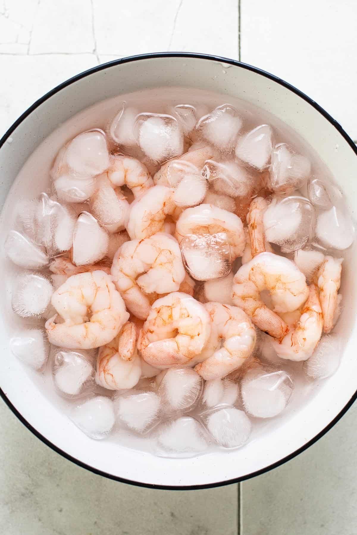 Shrimp in a large bowl with ice water