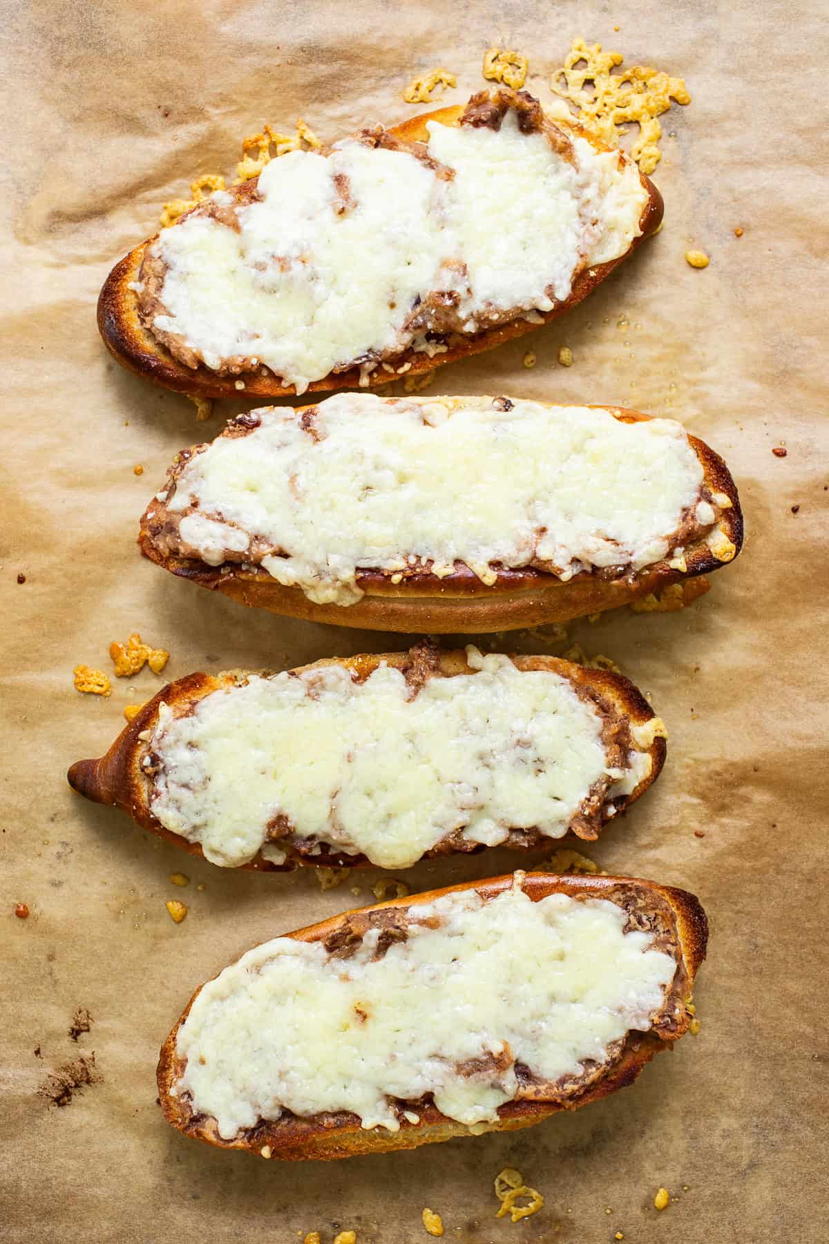 Melted cheese on a bolillo bread.