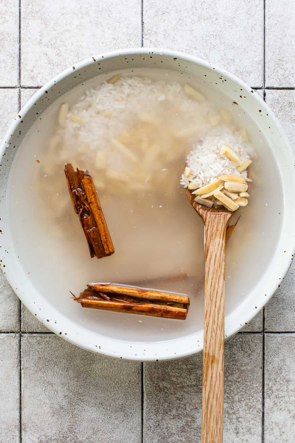 Soaked rinsed rice with almonds, cinnamon, and water