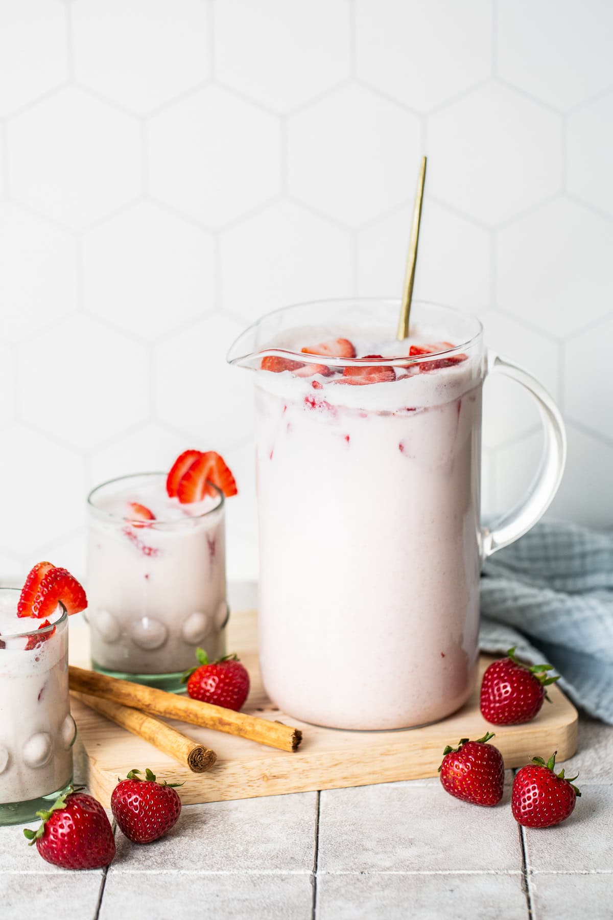 Strawberry horchata served in glasses with strawberry slice toppings