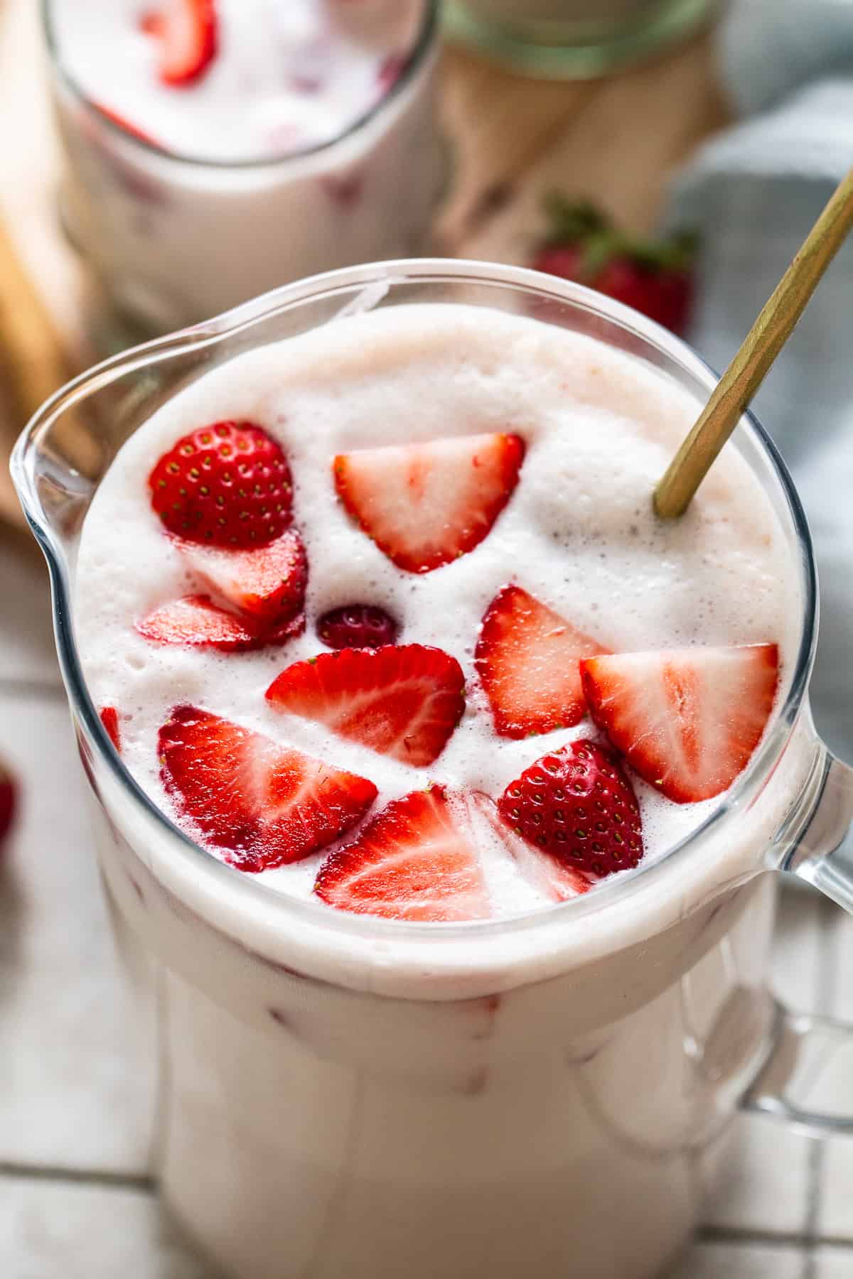 Strawberry horchata in a large pitcher