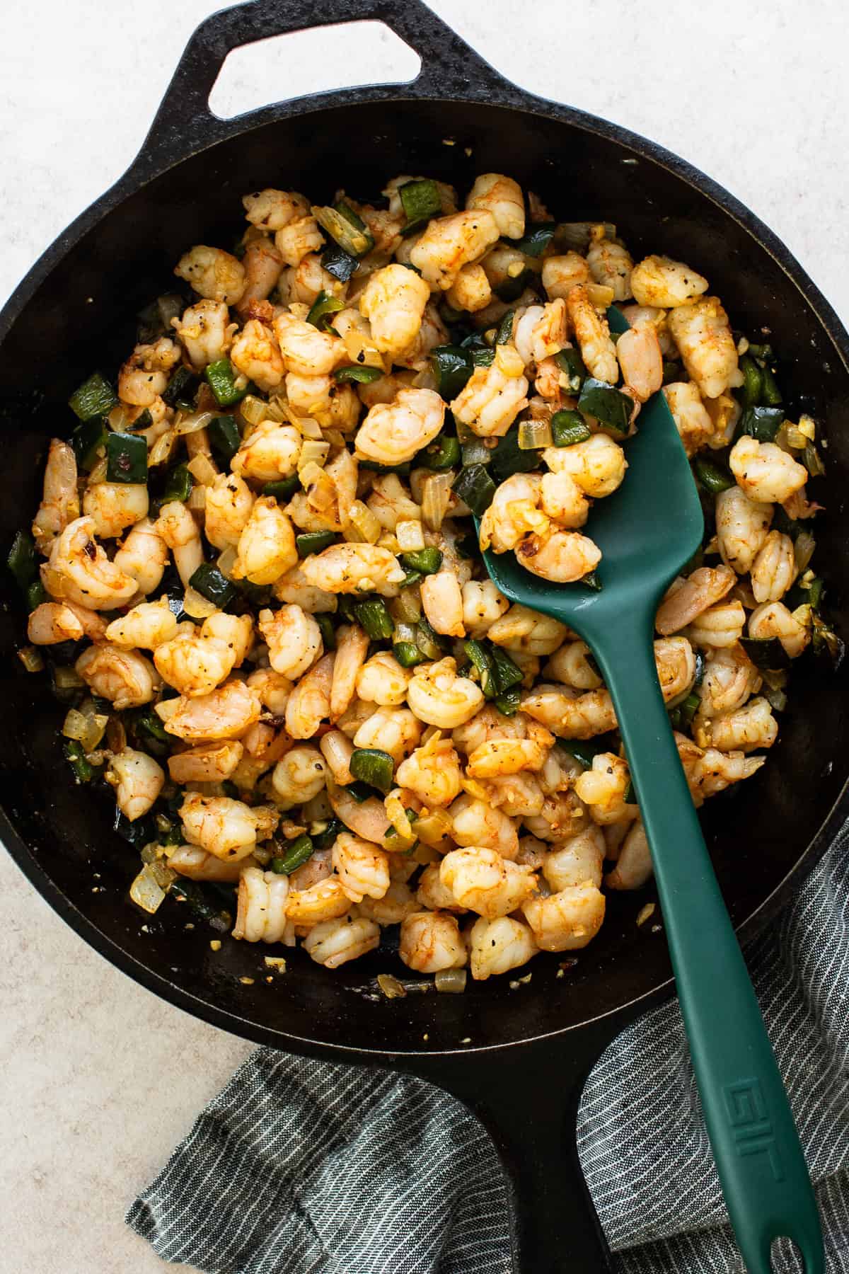 Shrimp filling ingredients all sautéed together in a large pan 