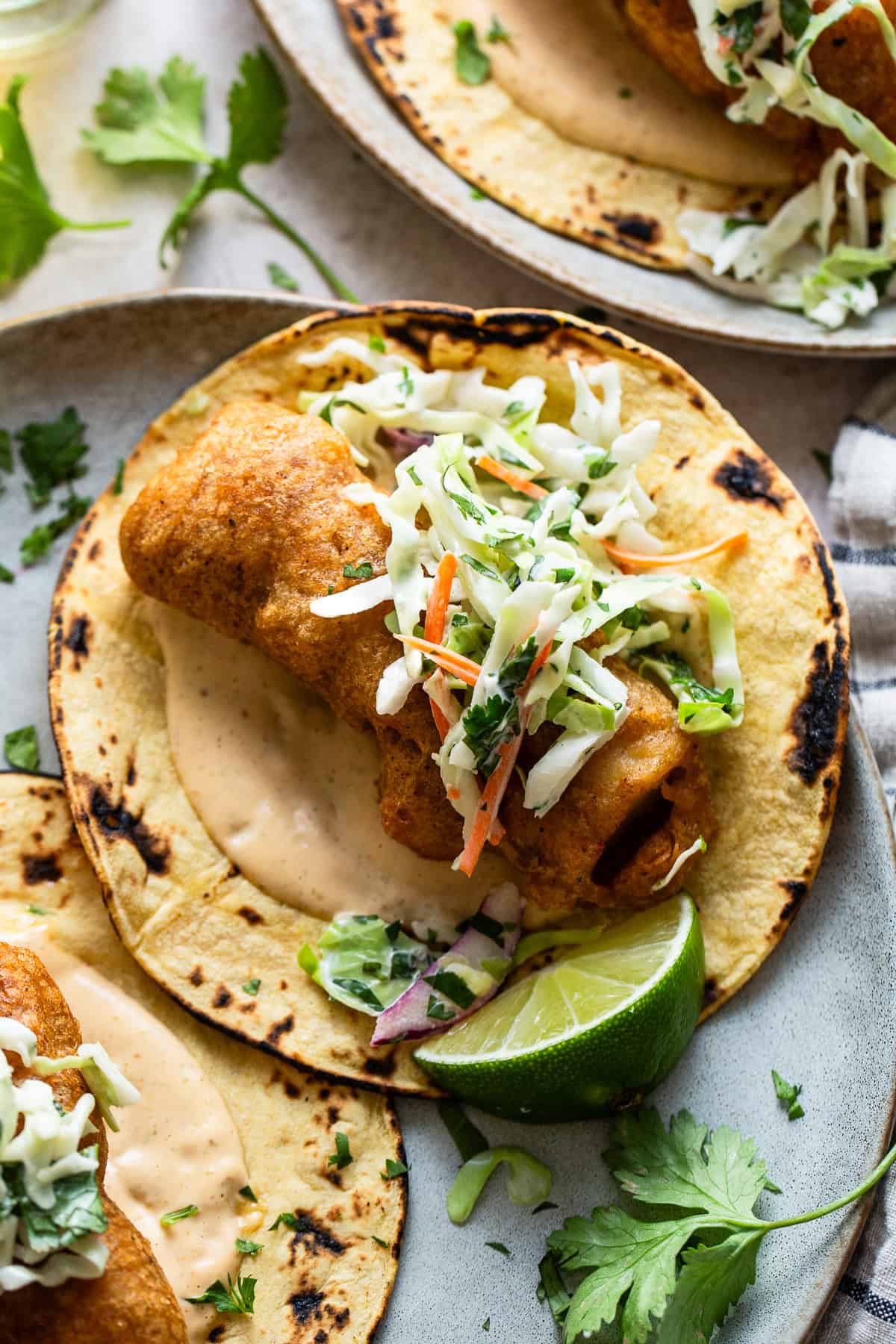 A baja fish taco made with crispy fried fish on a tortilla.