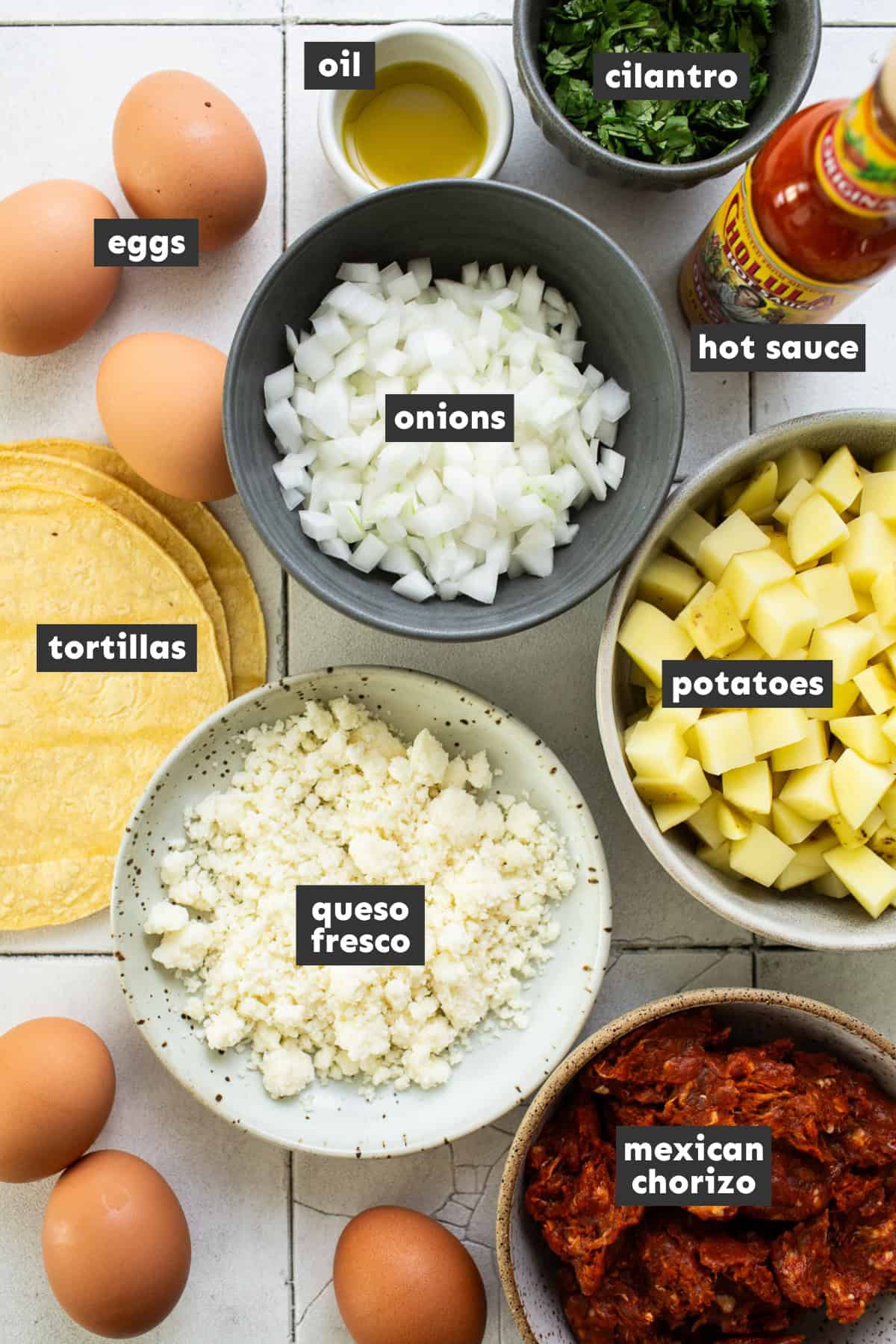 Ingredients in breakfast tacos on a table.