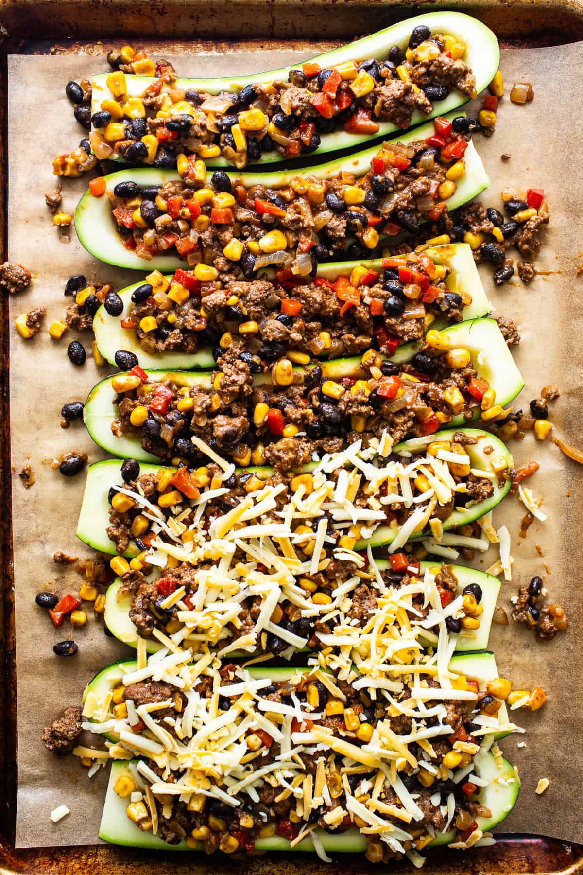 Assemble zucchini boats and fill with the meat mixture.