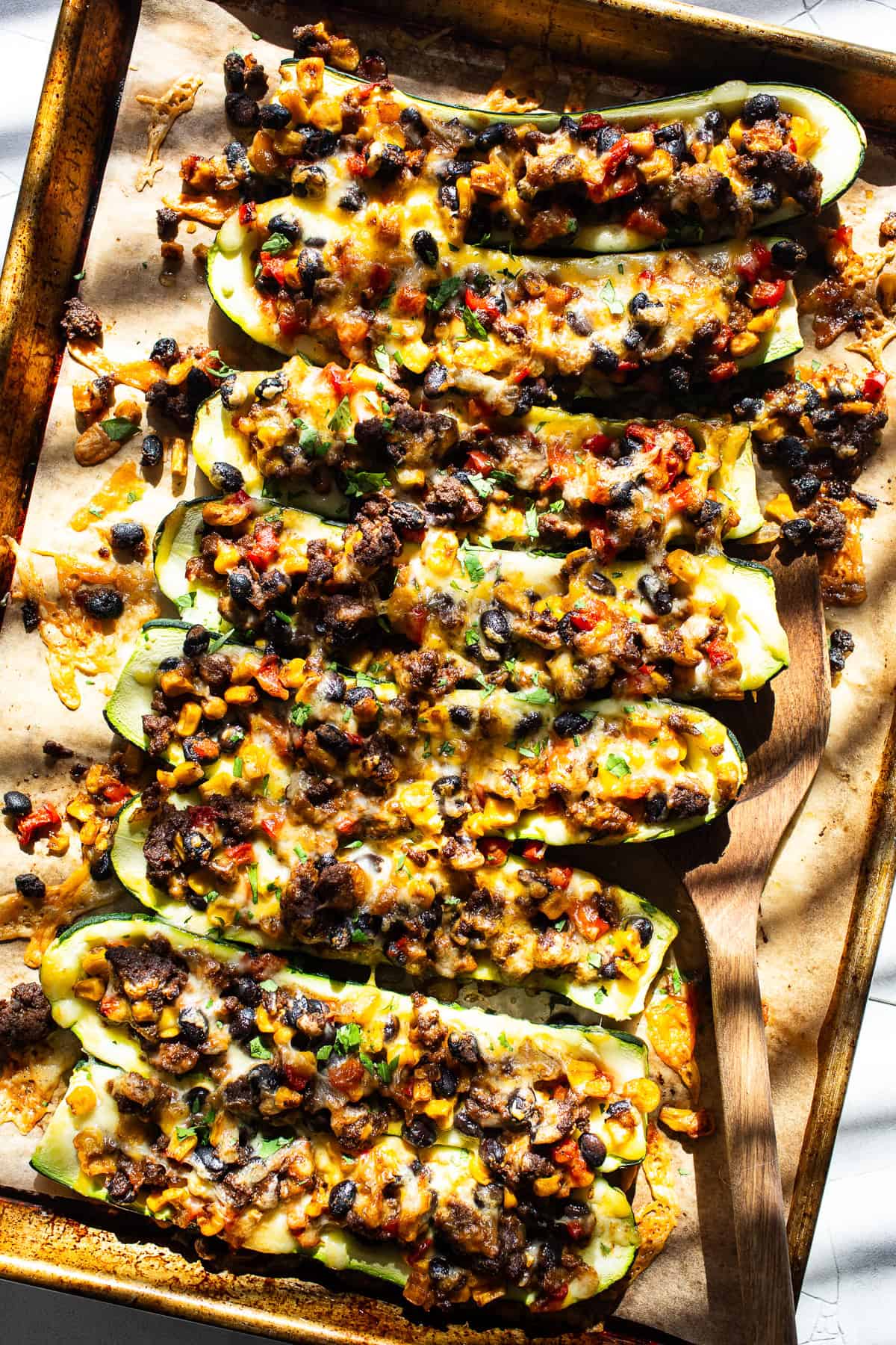 Mexican stuffed zucchini boats on a baking sheet ready to enjoy.