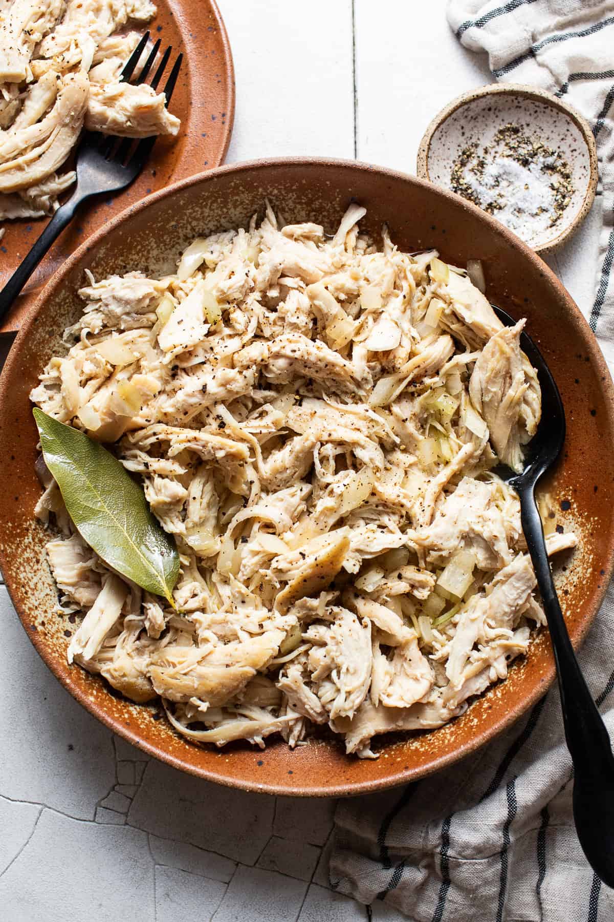 Shredded chicken in a bowl ready to be used in recipes.