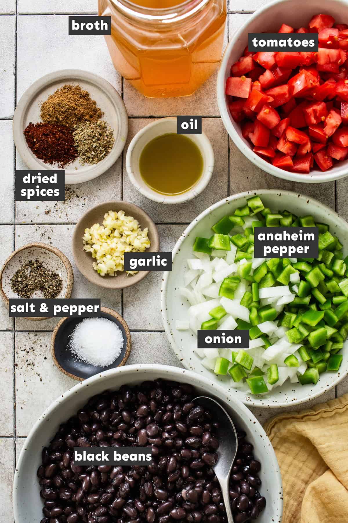 Ingredients for black bean soup on a table ready to be used.