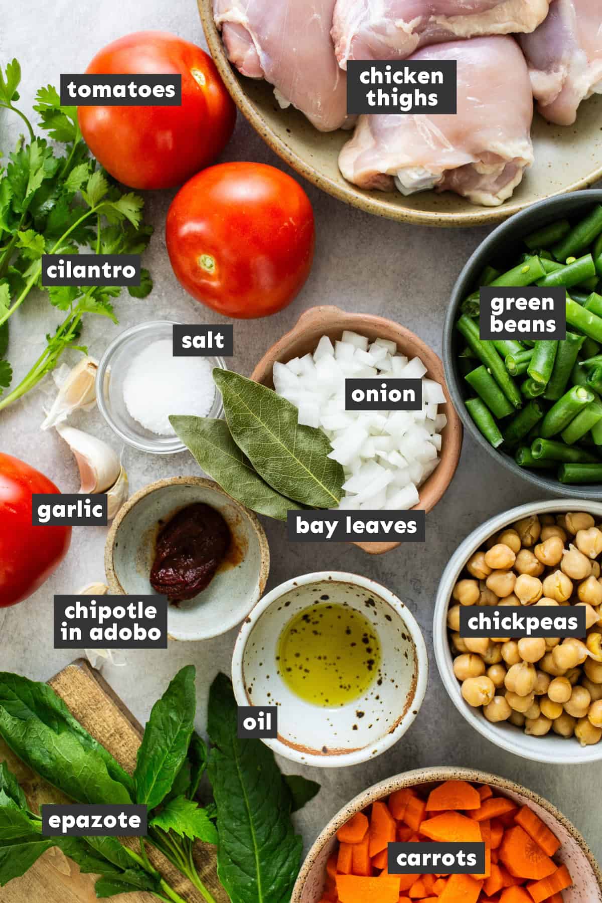 Ingredients in caldo tlalpeño on a table.