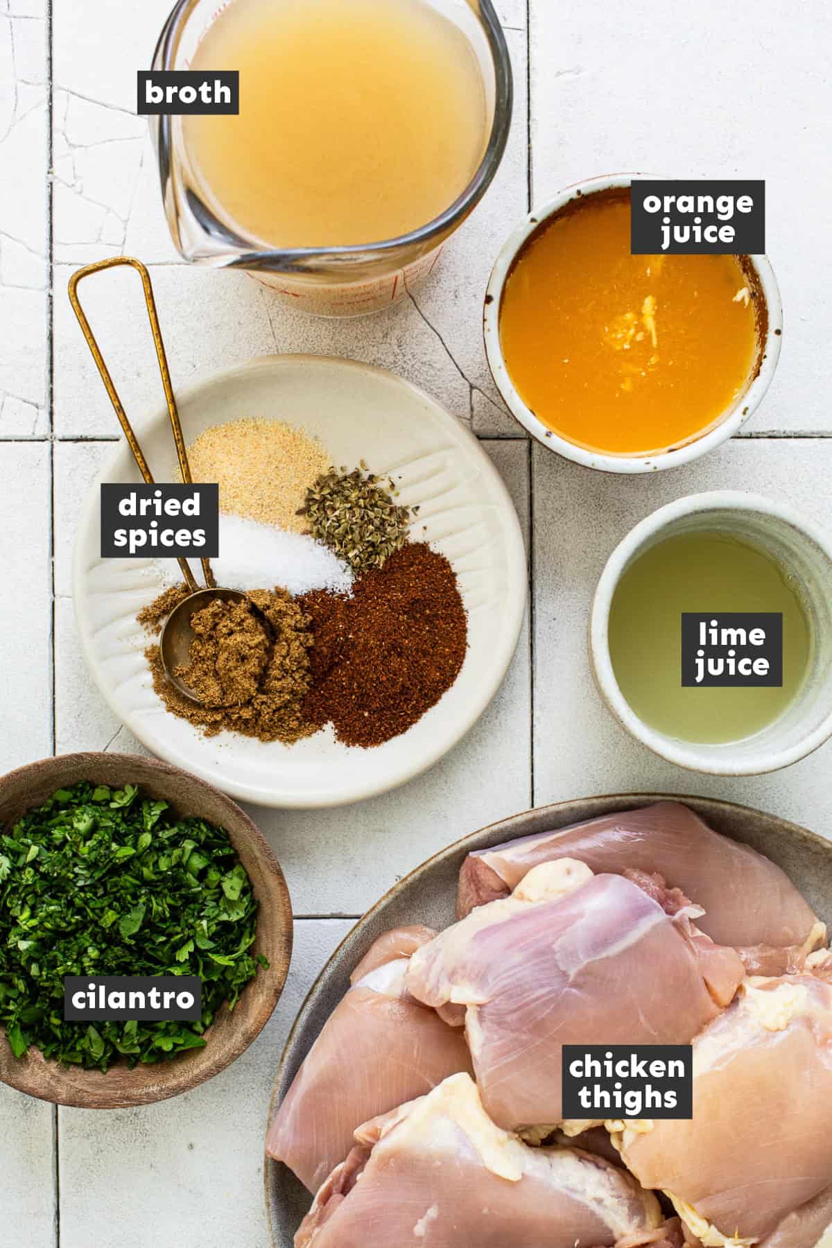 Ingredients for chicken carnitas on a table ready to use. 