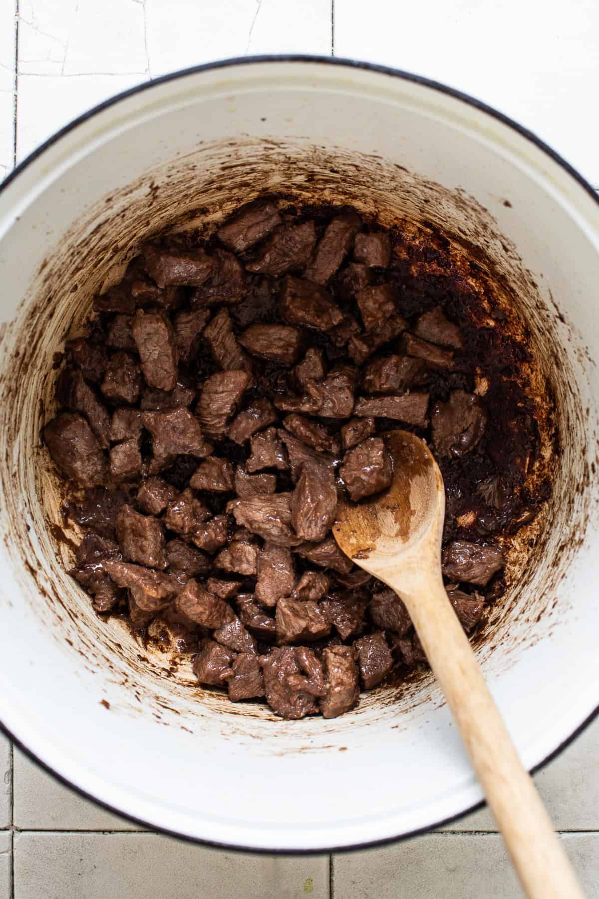 Beef browned in a pot for making chile colorado.