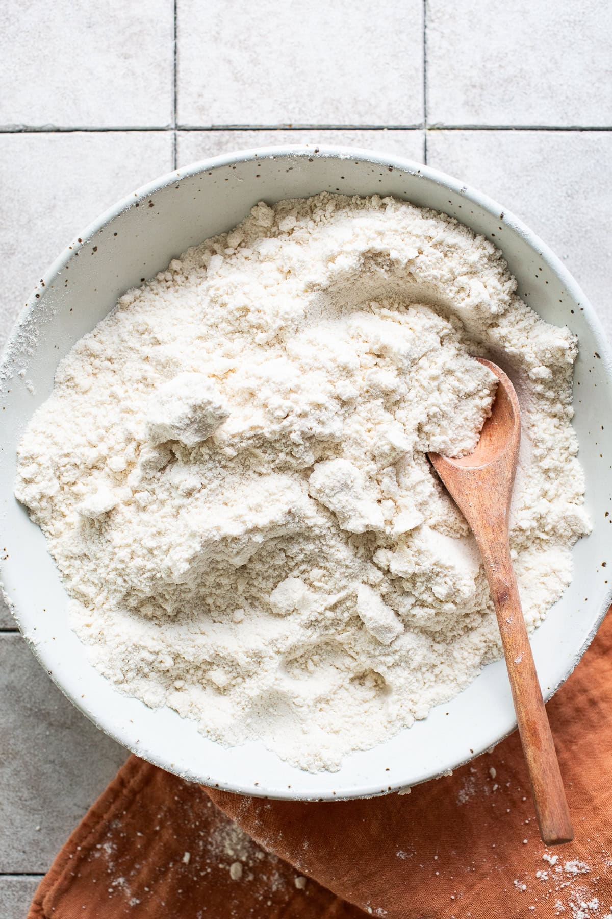 Dry ingredients for gorditas de azucar well combined in a mixing bowl.