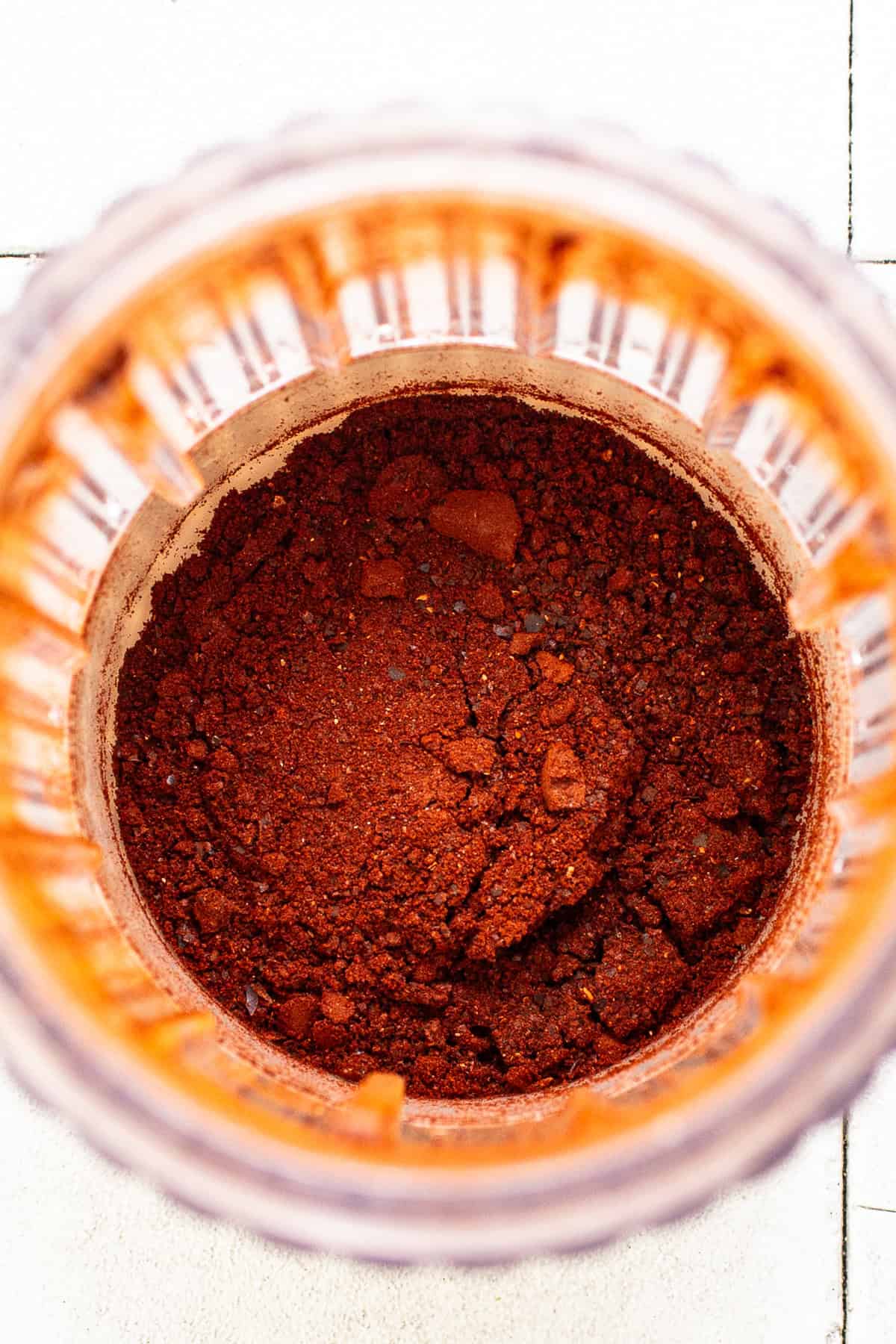 Guajillo chiles ground into a fine powder in a blender or spice grinder.