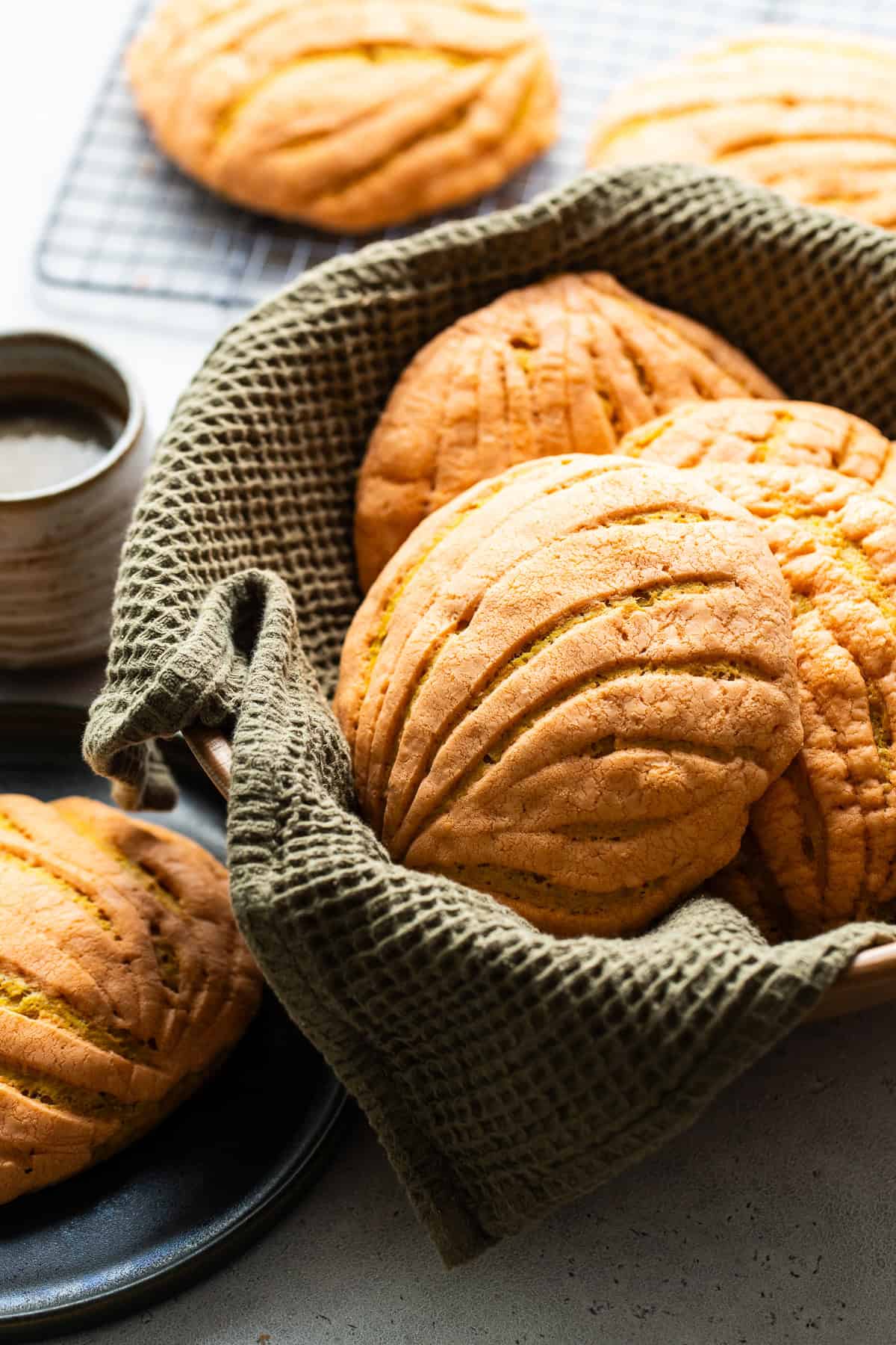 Warm pumpkin conchas in a basket ready to eat.