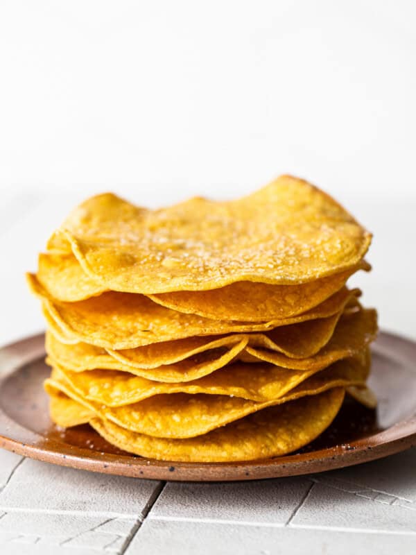 Homemade tostada shells on a plate ready to be served.