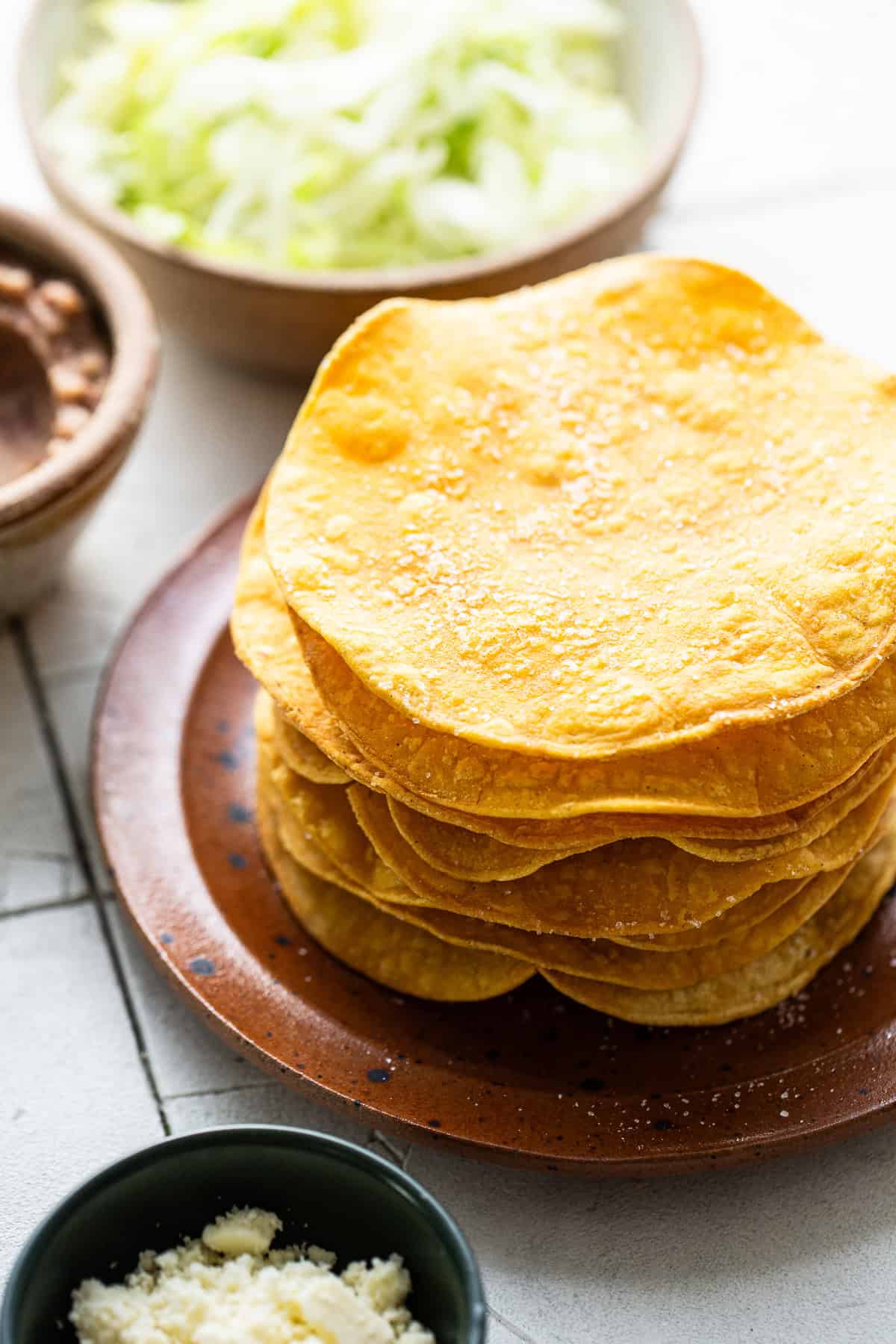 Tostada shells on a plate ready to be enjoyed.