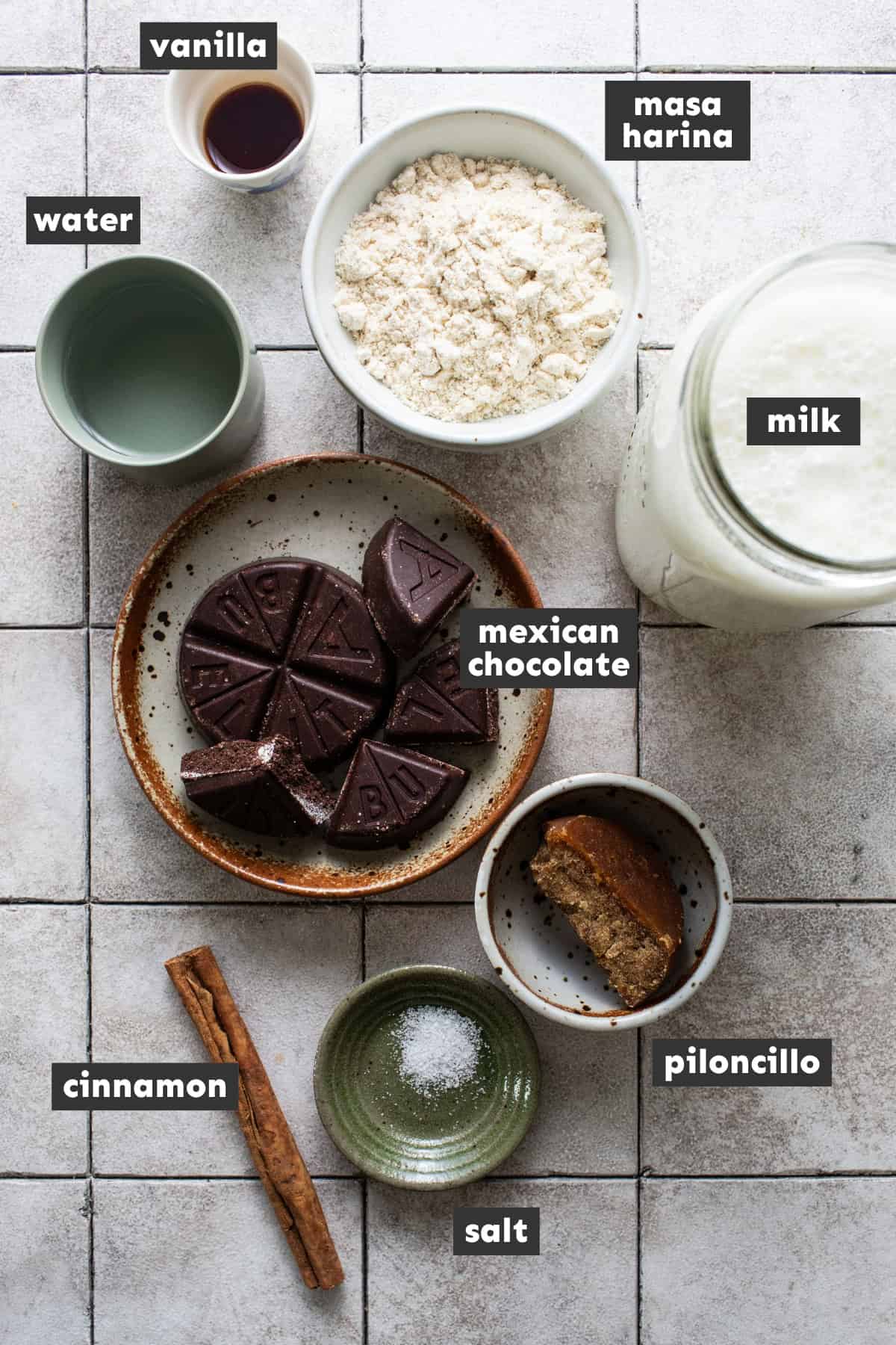 All ingredients for champurrado recipe are laid out on a table ready to use.