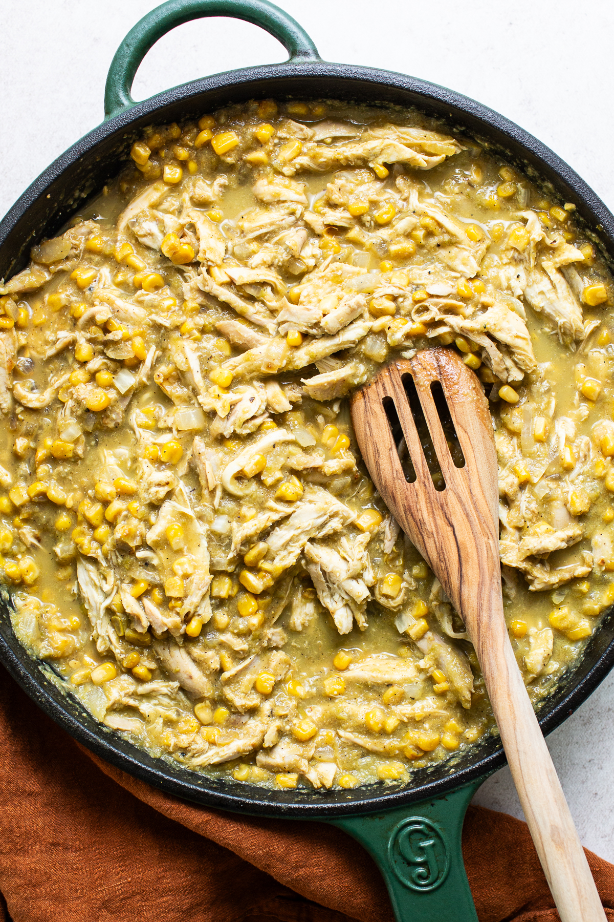 The chicken and corn filling for pastel Azteca in a skillet.