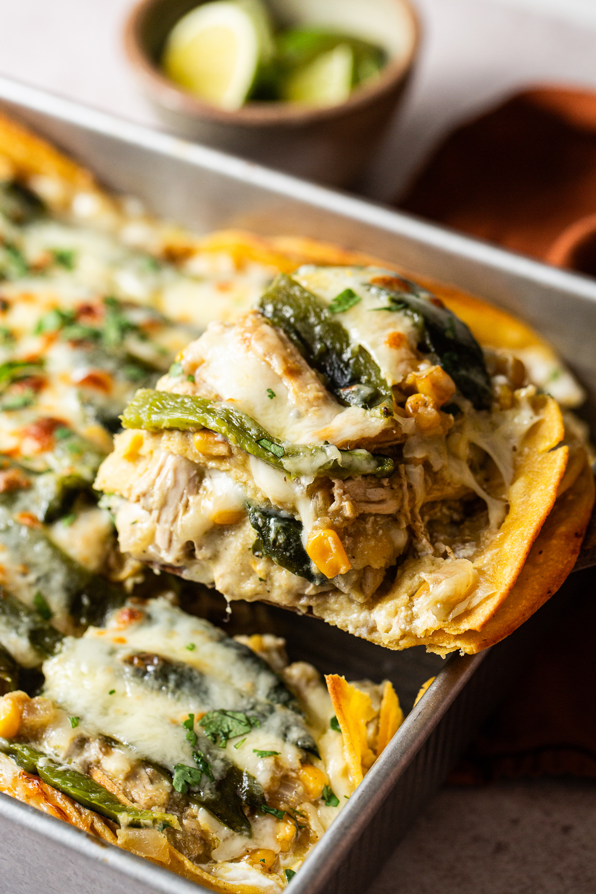 Baking dish filled with freshly baked pastel Azteca ready to eat.