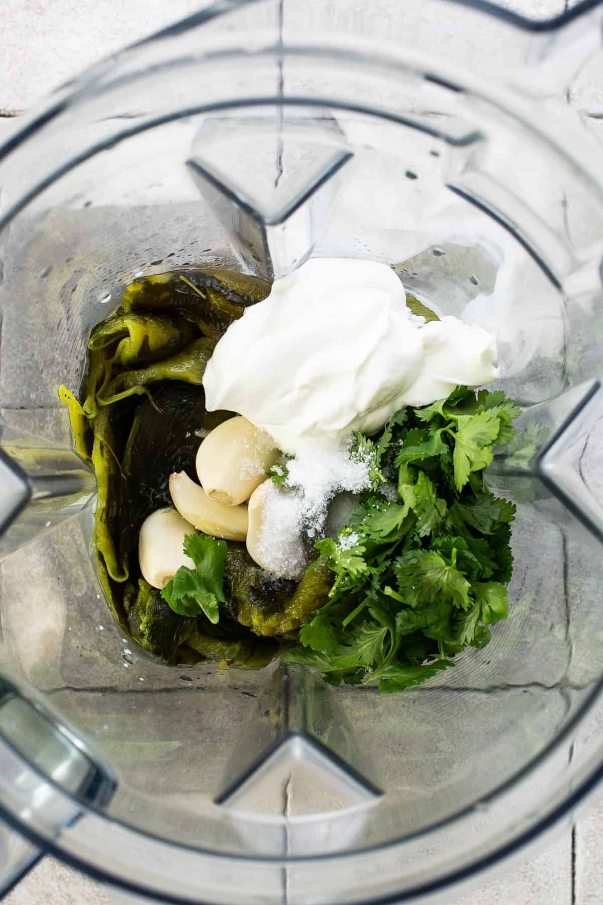 Add all the ingredients for poblano cream sauce in a large blender.