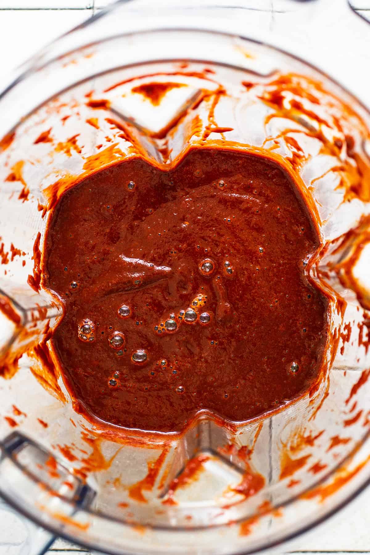 Ingredients for the chile broth in pozole in a blender that's been blended until completely smooth. 