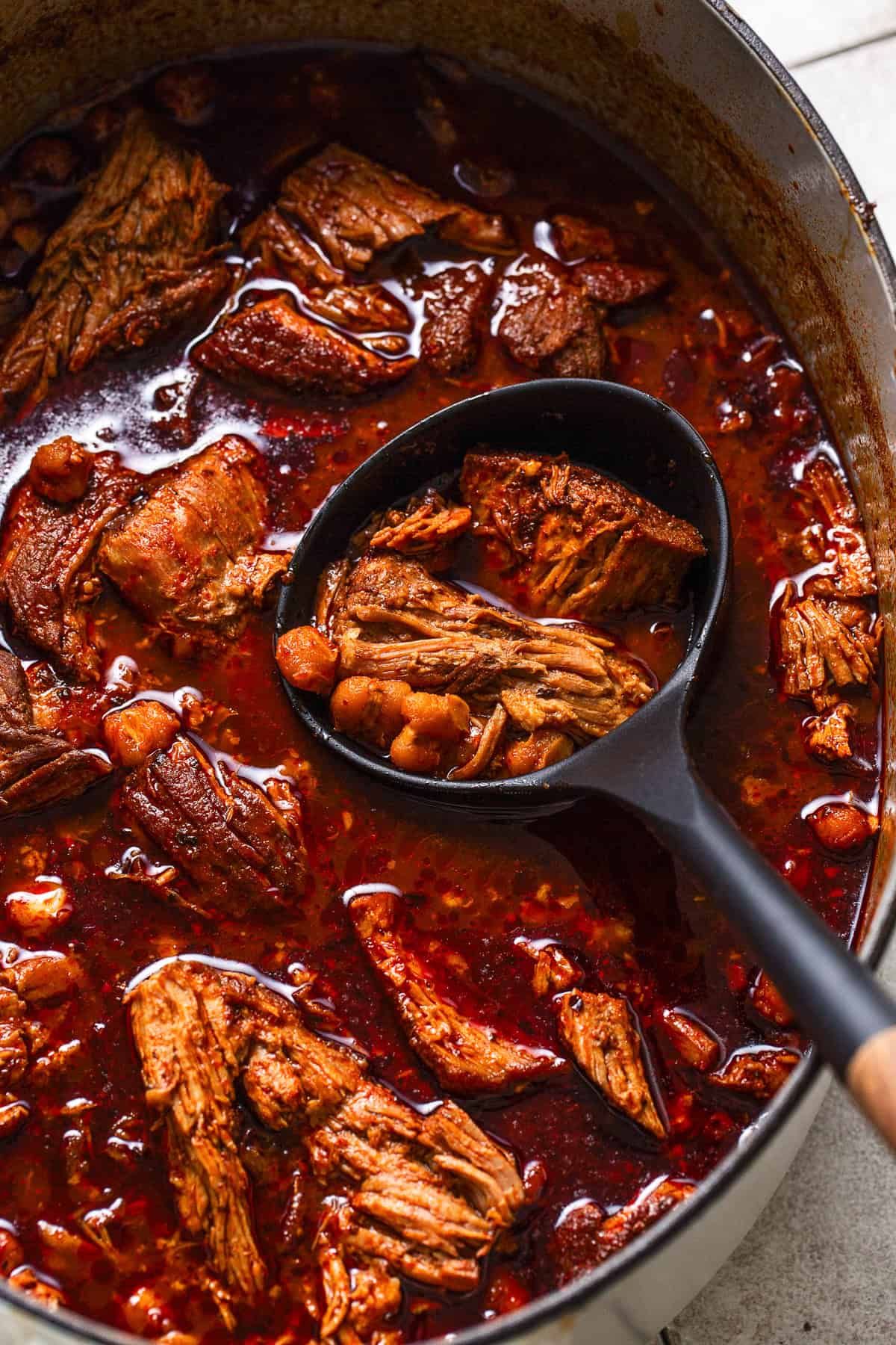 Mexican pozole rojo recipe in a pot ready to be served.