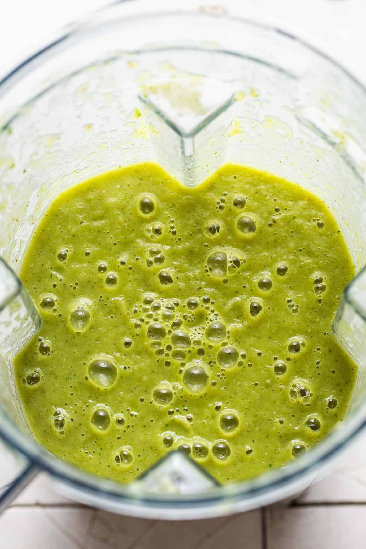 The blended verde broth for pozole verde in a blender ready to be used.