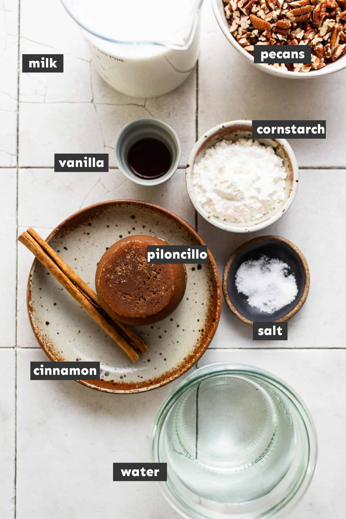 All the ingredients for atole de nuez laid out on a table ready to use..