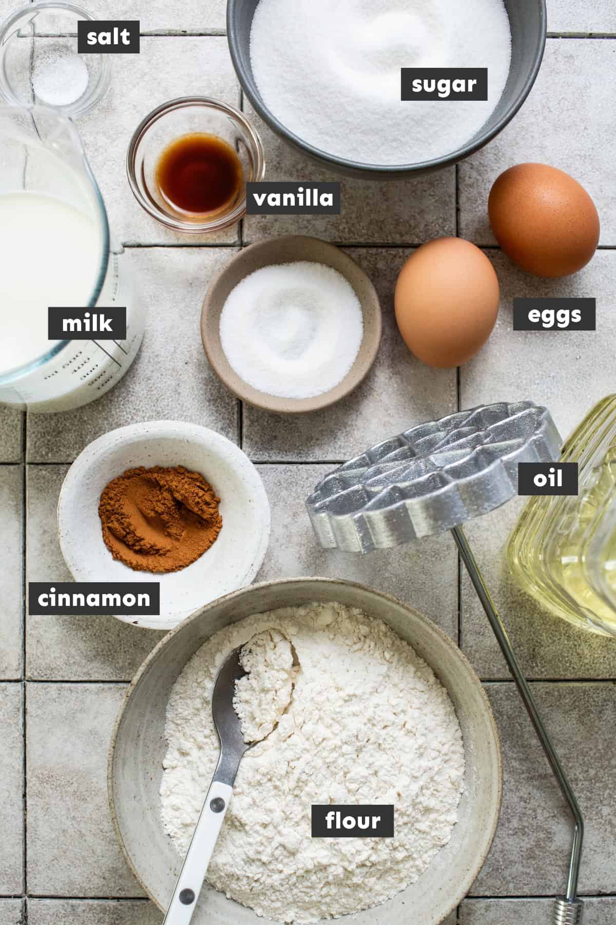 All of the ingredients for buñuelos de viento are laid out on a table ready to use for this recipe. 