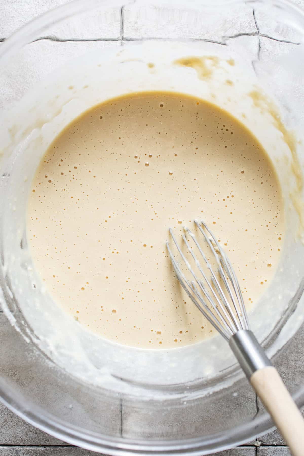 The batter for buñuelos de viento being whisked together in a bowl.