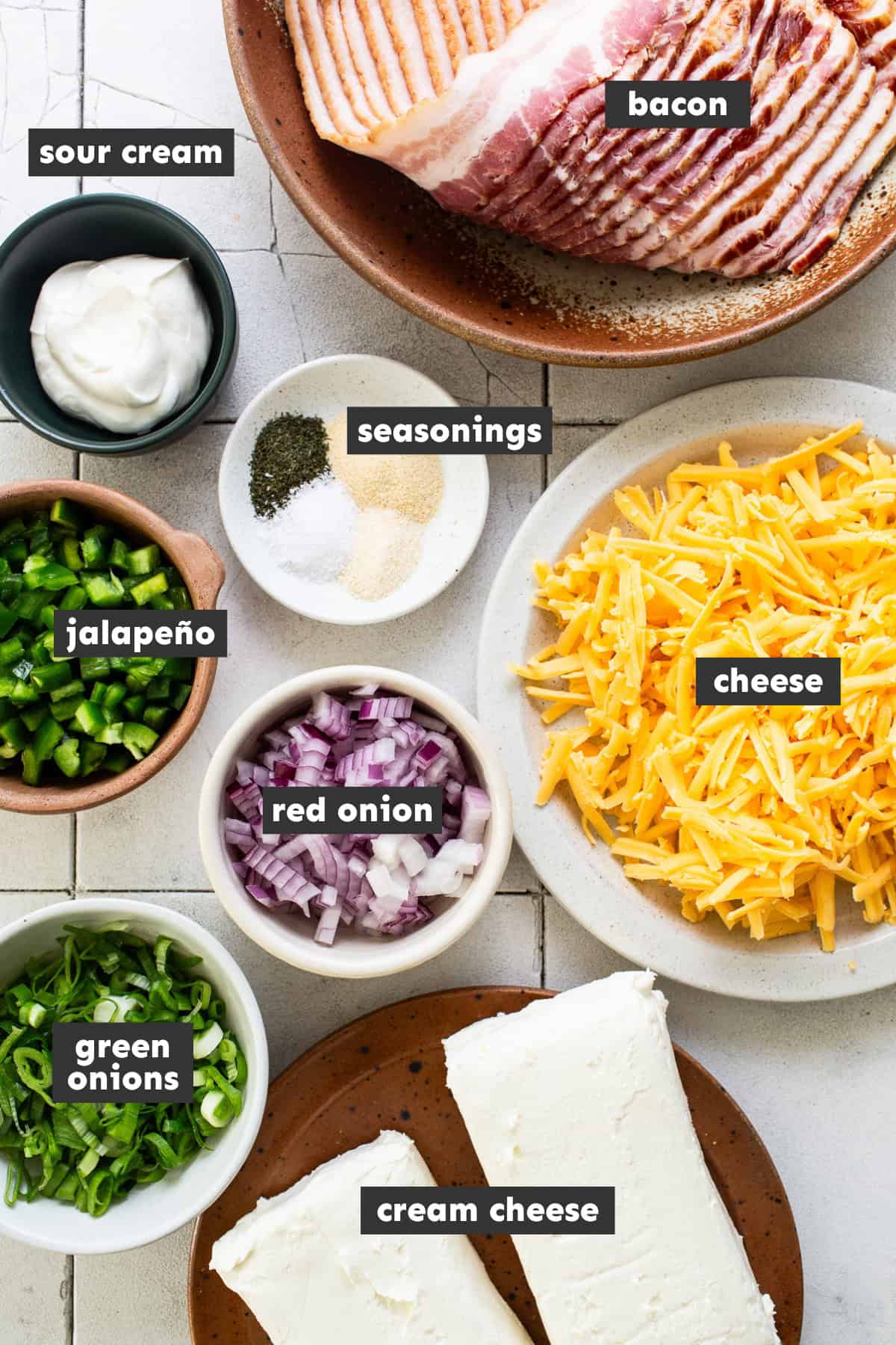 Ingredients for a jalapeño cheese ball on a table.