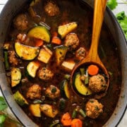 Albondigas soup ready to eat in a Dutch oven.