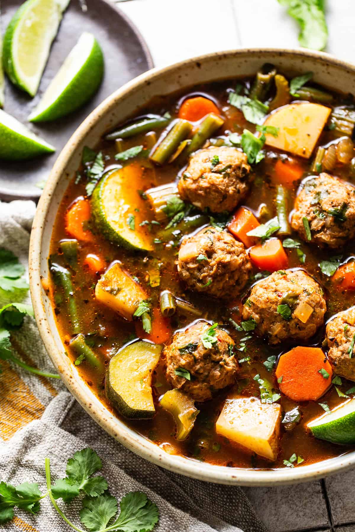 Albondigas soup recipe made with juicy mexican meatballs made from beef, chorizo, and rice.