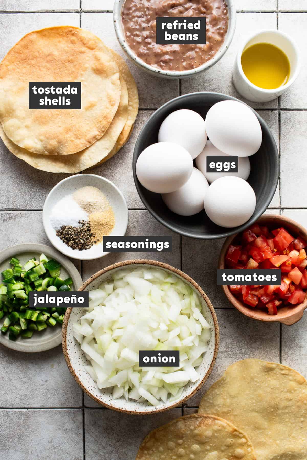 All ingredients for breakfast tostadas laid out on a table ready to cook.