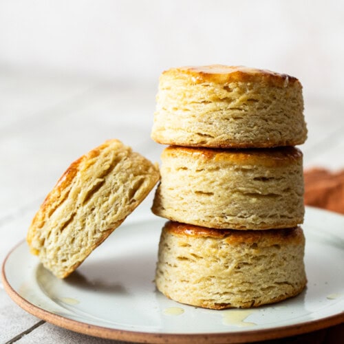 Masa harina biscuits stacked on top of each other on a plate.