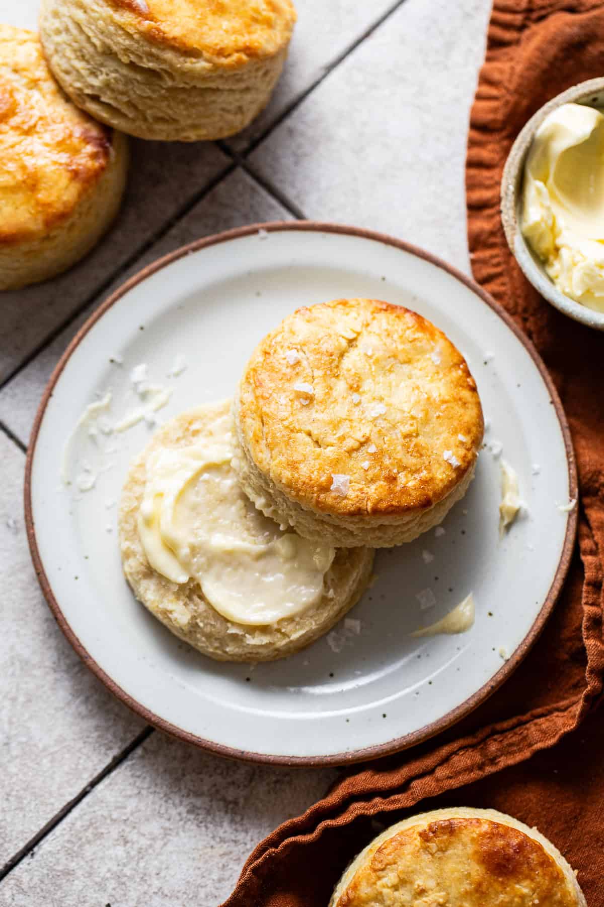 A warm masa harina biscuit cut in half and smeared with room temperature butter and topped with flaky sea salt.