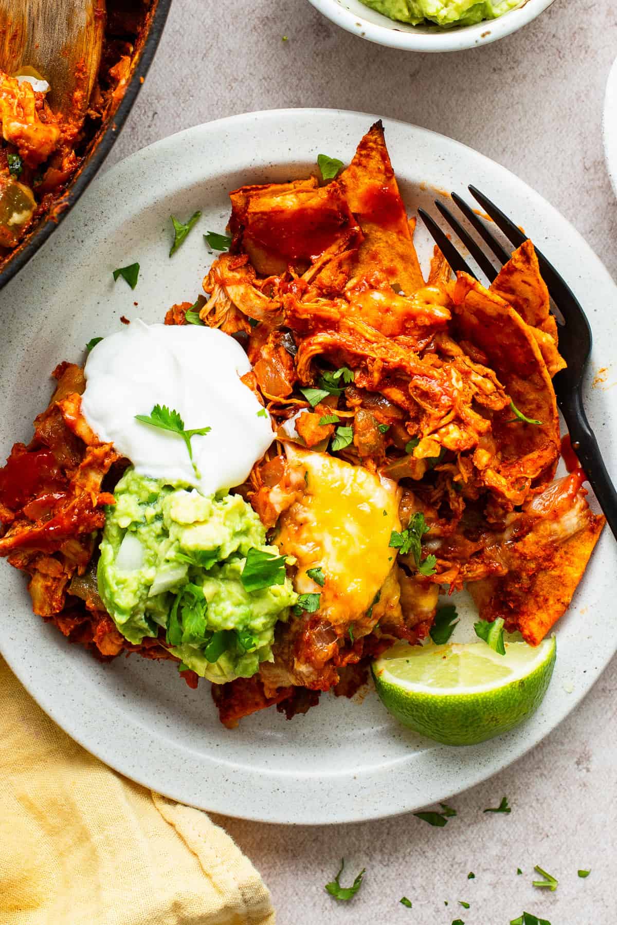 A dinner plate with chicken enchilada skillet served and ready to enjoy.