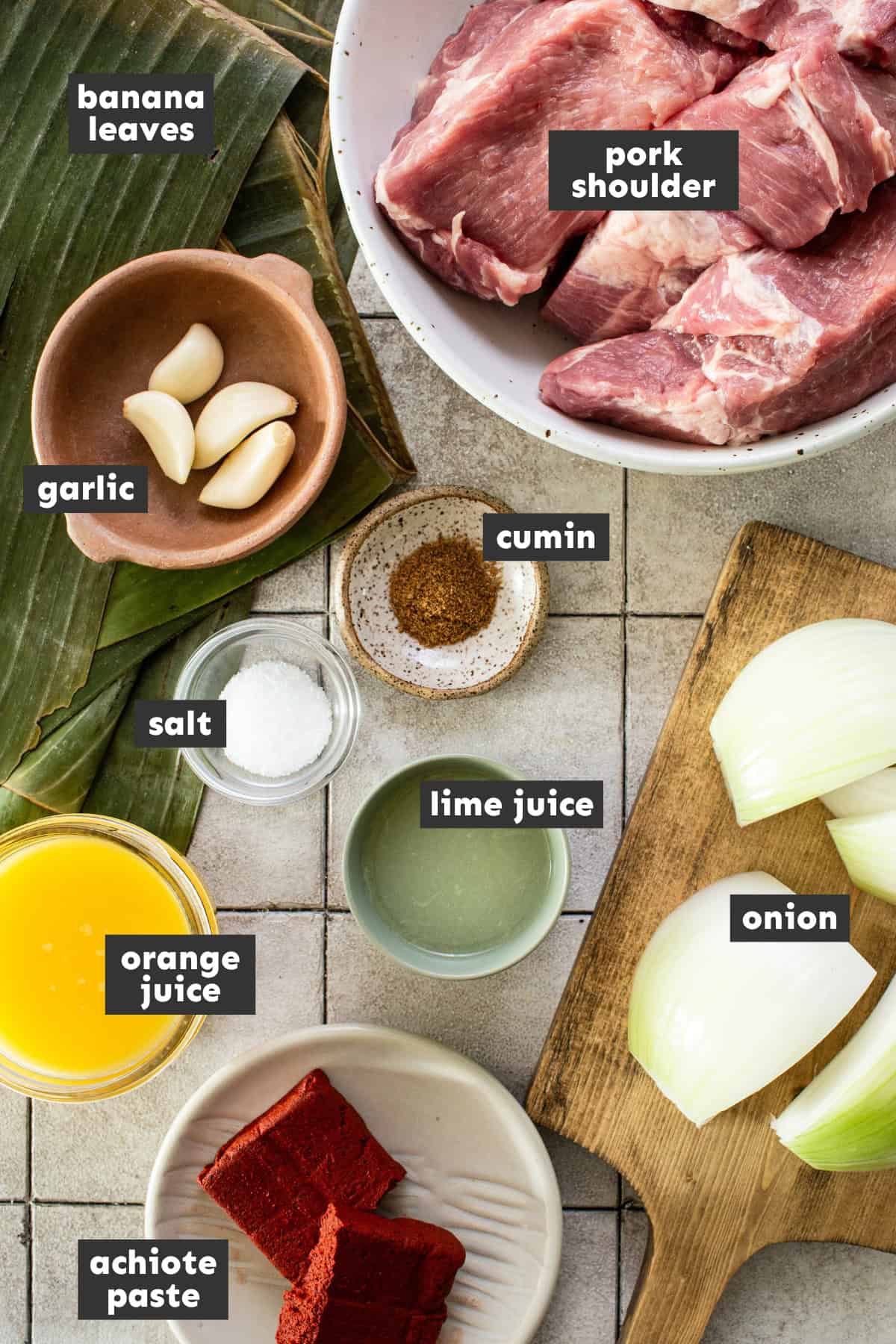 Ingredients for cochinita pibil on a table.