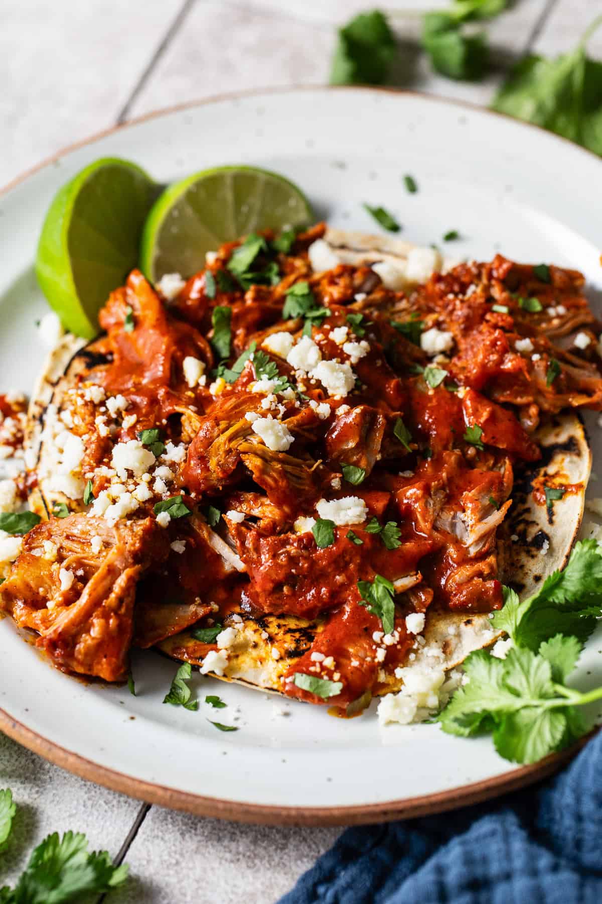 Cochinita pibil tacos on a plate.